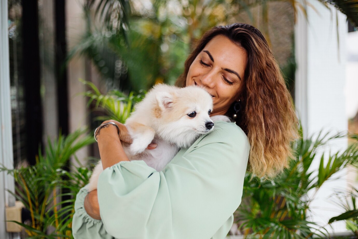 Outdoor Portrait Curly European Tanned Woman Holds Happy Pet Dog Pomeranian Spitz 343596 1362